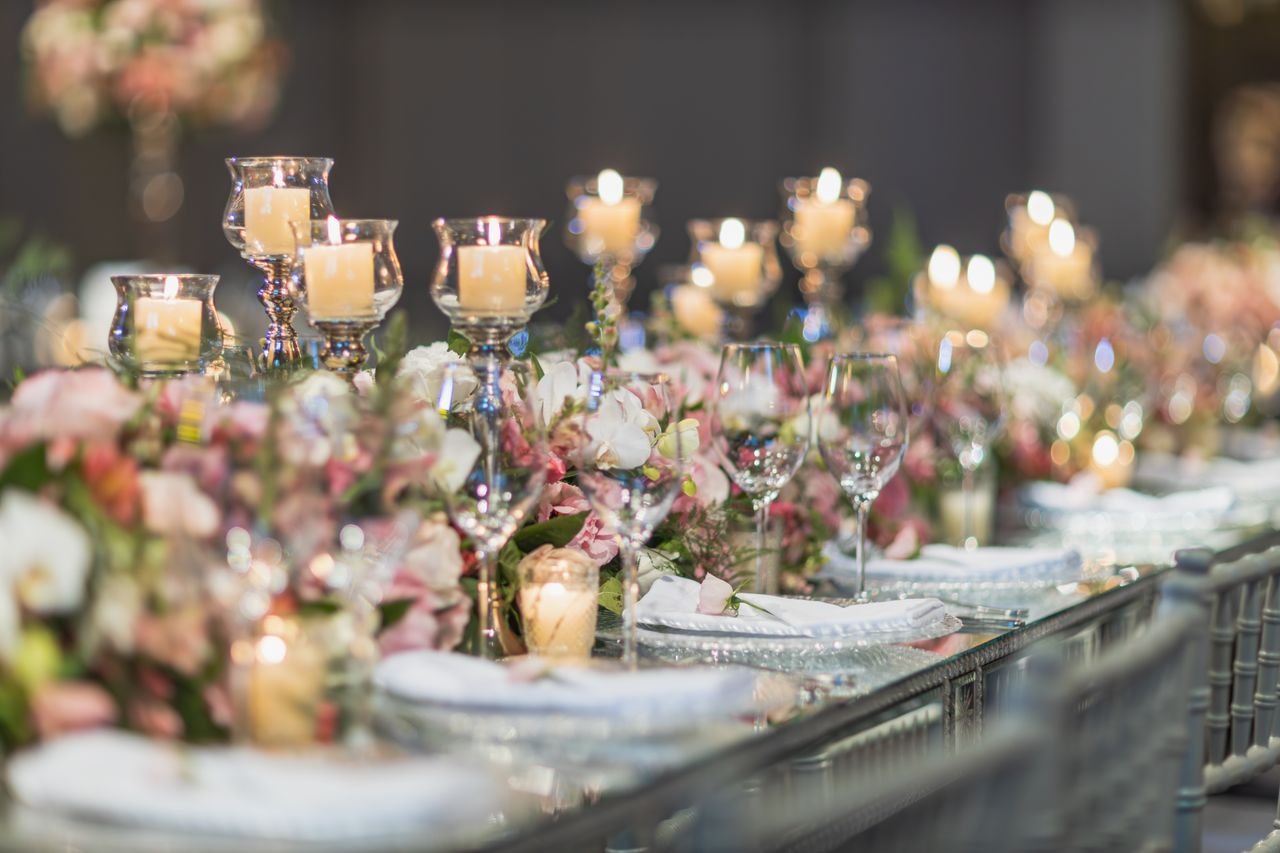 services-04 A beautifully decorated wedding table featuring candles and floral arrangements, perfect for elegant receptions.